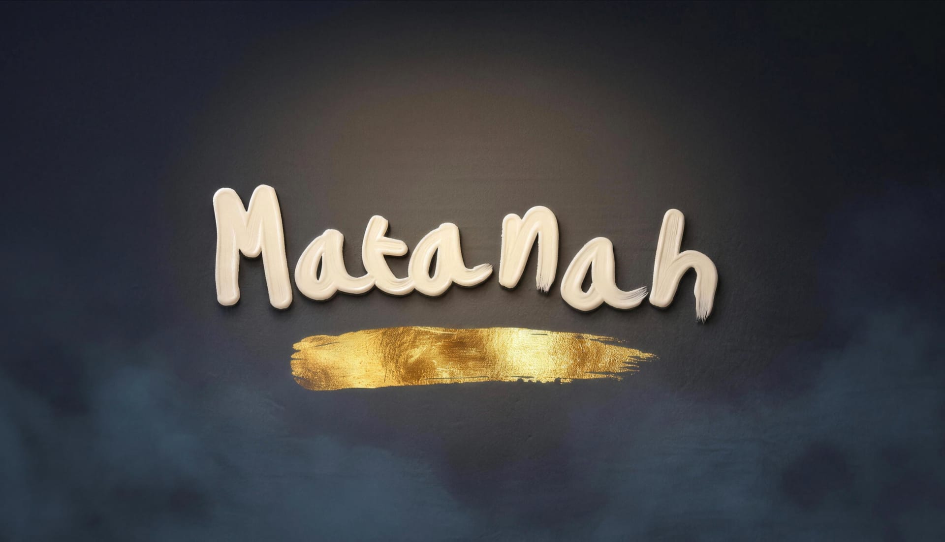 The Matanah wordmark, hand painted in cream over a gold leaf stroke on a dark slate wall.